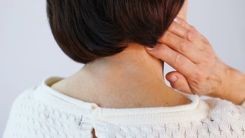 Senior Woman Massaging Her Neck