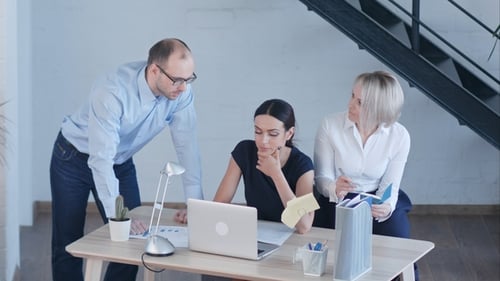 Business People Discussing Project in Modern Office