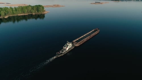 Aerial Drone footage.Fly Over Barge in Calm Water