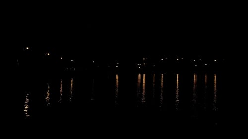 City Lights Reflecting on Water at Night