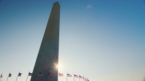 Washington Monument With American Flags at Sunrise