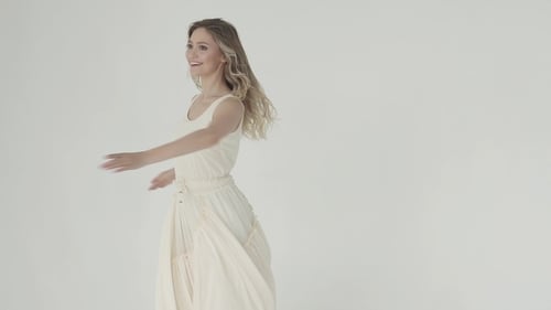 Woman in Dress Twirling Gracefully in Studio