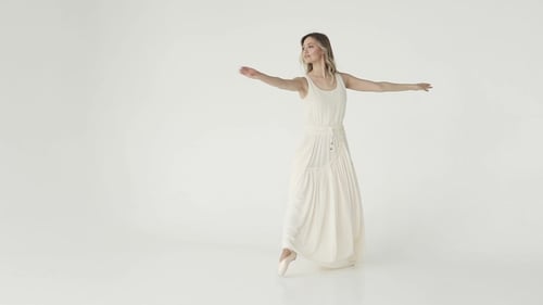 Graceful Ballerina Dancing and Twirling in Studio