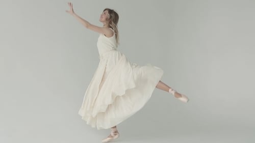 Woman Dancing Ballet in White Dress