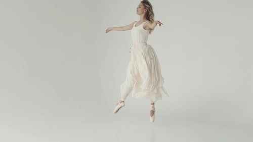 Elegant Woman Ballet Dancing in White Studio