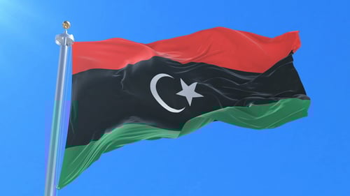 Libya Flag Realistic Waving in Blue Sky