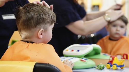Child Getting a Haircut in a Salon