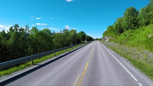 Driving a Car on a Road in Norway Atlantic Ocean Road