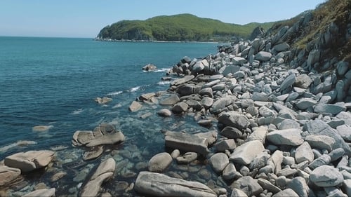 Aerial Drone Flight Around the Rocks in Sea on Tropical Coast