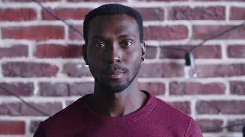 Young Man Smiles Directly into the Camera