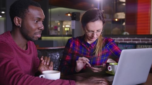 A Man and a Woman in a Cafe Discussion, the Idea of a Startup
