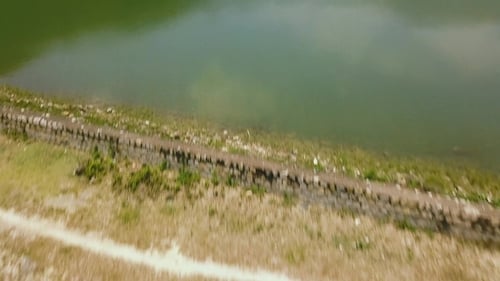Beautiful Lake in Green Mountains Covered Tropical Forest Aerial Footage. Natural Landscape River