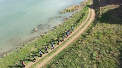Group Of People Trekking By The Lake On Aerial View 3