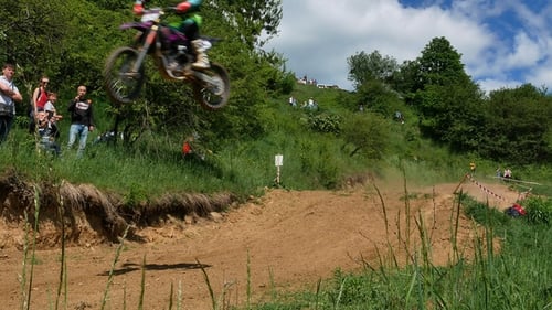 Motocross Racers Speeding Through Outdoor Course