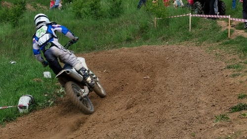 Motocross Riders Racing on Dirt Track