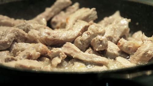 Roast Pork in a Pan in Oil and Stir
