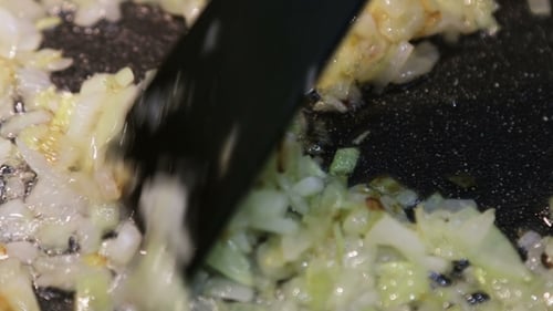 Fry Onions in a Pan in Oil and Stir
