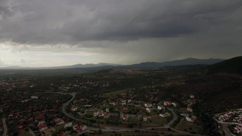 Drone Flying and Descending Over Town, View To Cottages and Green Spaces, Greece