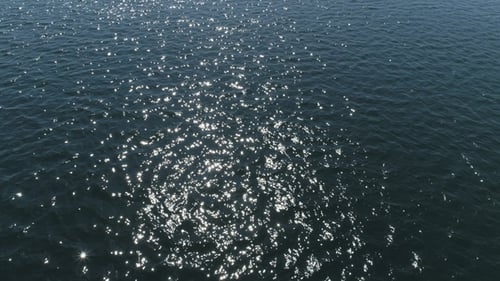 Sunlight Shimmers on Blue Ocean Water