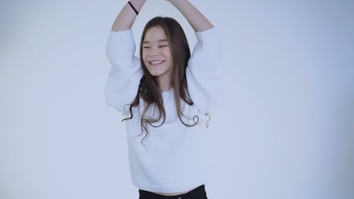 Teen Girl Dances and Smiles Happily