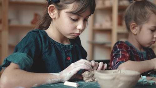 Potter's Craft. Children Make Crafts From Clay in a Cozy Light Workshop