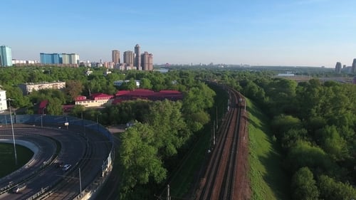 Moving Suburban Electric Train on the Bridge Near the Junction