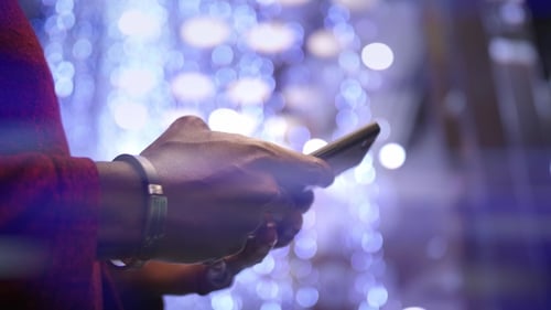 African American Man Using Business App on Smart Phone