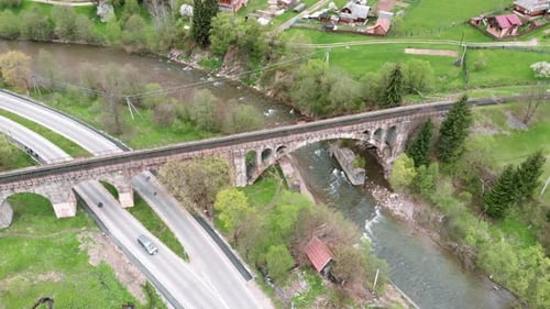 Carpathians, Ukraine. Railway stone viaduct bridge over river