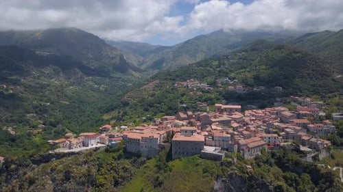 Aerial Medieval Village on Cliff Overlooking Mountain Gorge, Old Town Buildings with Red Tile Roofs