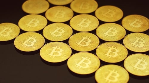Golden Bitcoins Lying in Rows