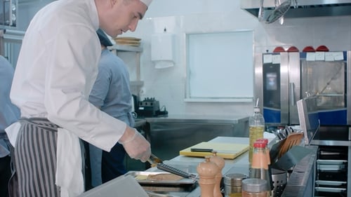 Busy Chefs at Work Cooking in the Restaurant Kitchen