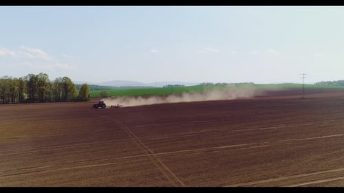 Tractor Working in Beautiful Spacious Agricultural Field