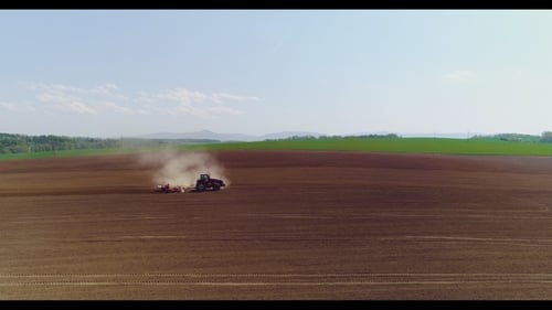 Tractor Working in Beautiful Spacious Agricultural Field
