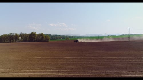Tractor Working in Beautiful Spacious Agricultural Field