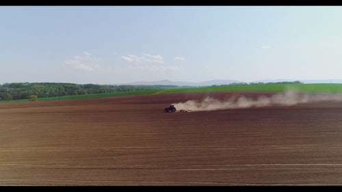 Tractor Working in Beautiful Spacious Agricultural Field