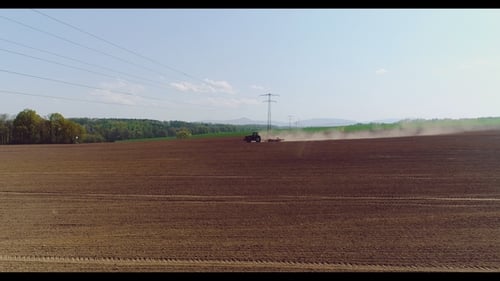 Tractor Working in Beautiful Spacious Agricultural Field