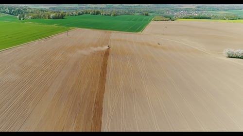 Tractor Working in Beautiful Spacious Agricultural Field
