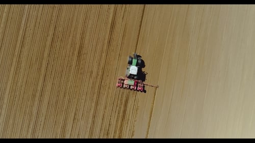 Tractor Working in Beautiful Spacious Agricultural Field