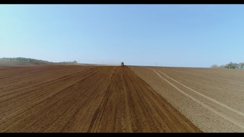 Tractor Working in Beautiful Spacious Agricultural Field