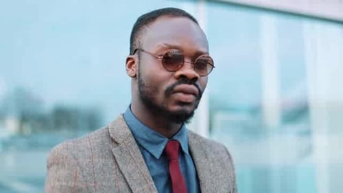 Business Professional Man in Urban Setting Stares Intently