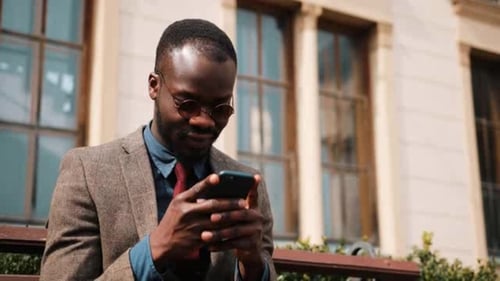 Well Dressed Man on Phone in Urban Setting