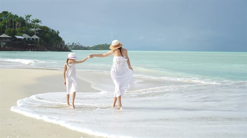 Beautiful Mother and Daughter on Caribbean Beach