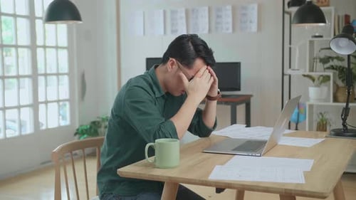 Upset Young Creative Designer Works On A Storyboard, Looks At His Sketches And Throw Papers