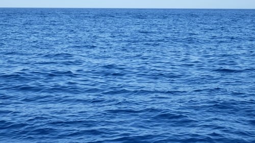 Blue Water Surface on Sea with Small Waves From the Wind