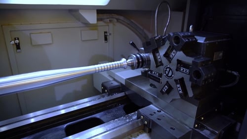 Metal Rod Being Cut by Industrial Machine