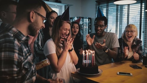 Woman Celebrates Birthday with Friends in Apartment