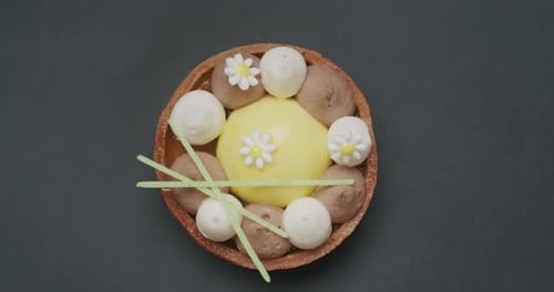 Pastry Tart Decorated with Cream Dollops and Flowers