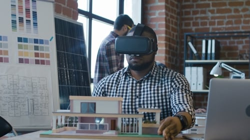 Architect Using VR Headset to Design Building