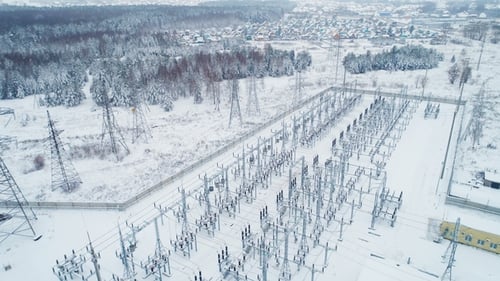 Electrical Substation and Power Lines in Winter Scene