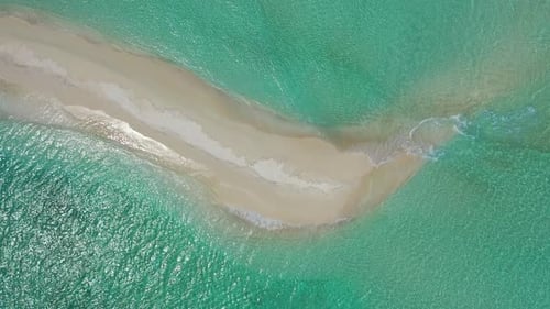 Daytime aerial tourism shot of a summer white paradise sand beach and aqua blue ocean background